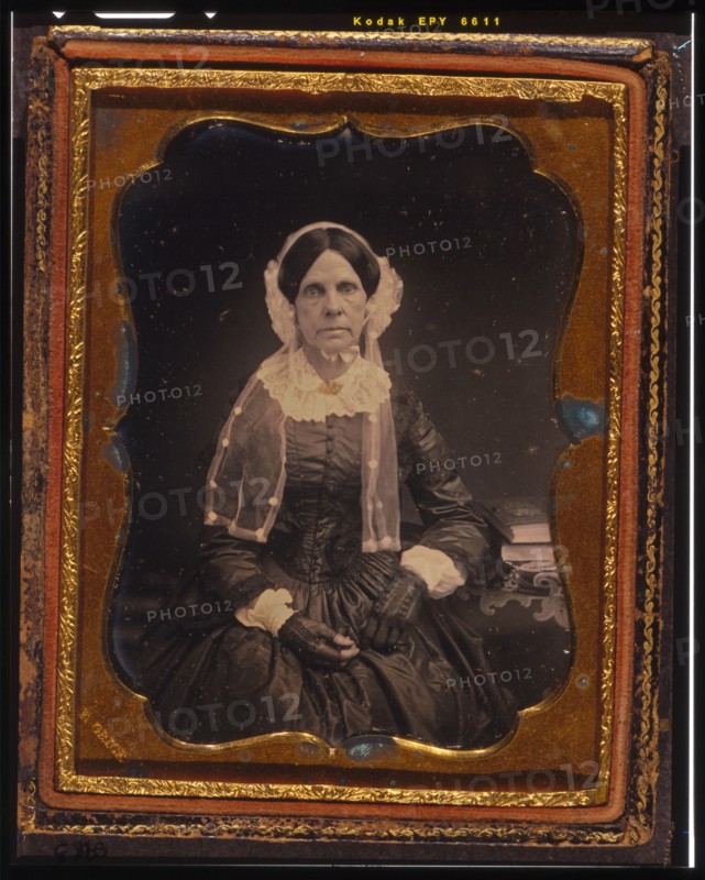Unidentified woman, three-quarters length portrait, seated with left arm resting..., ca. 1855. Creator: Francis Grice.