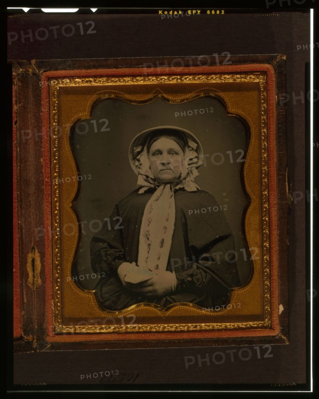 Unidentified woman, half-length portrait, wearing gloves, between 1840 and 1860. Creator: Unknown.
