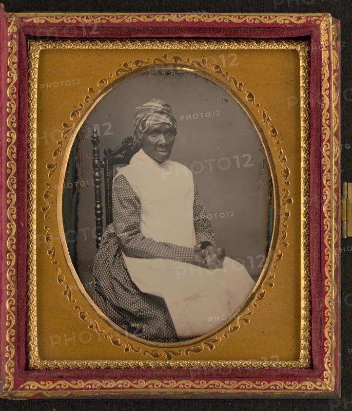 Unidentified African American woman in headscarf and apron, between 1850 and 1870. Creator: Unknown.
