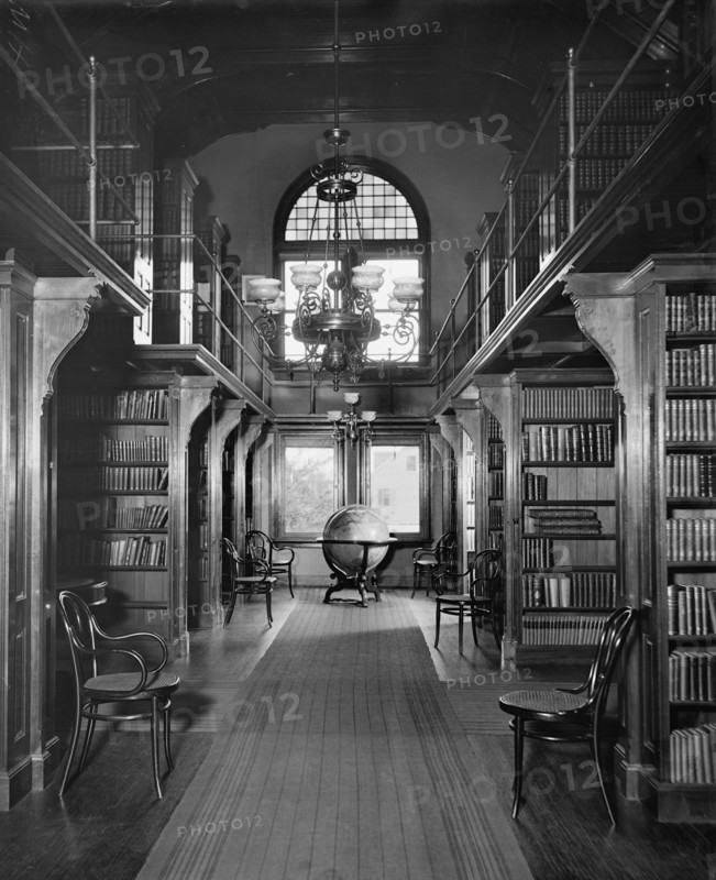 Shelves in library, U.S. Naval Academy, between 1890 and 1901. Creator: Unknown.