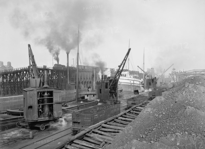 Whirleys unloading ore, Penna. R.R. [Pennsylvania Railroad] docks, Erie, Pa., ca 1900. Creator: William H. Jackson.