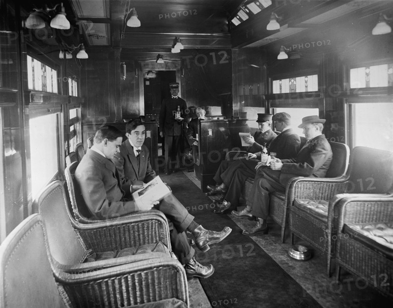 Buffet library car on a deluxe overland limited train, between 1910 and 1920. Creator: William H. Jackson.