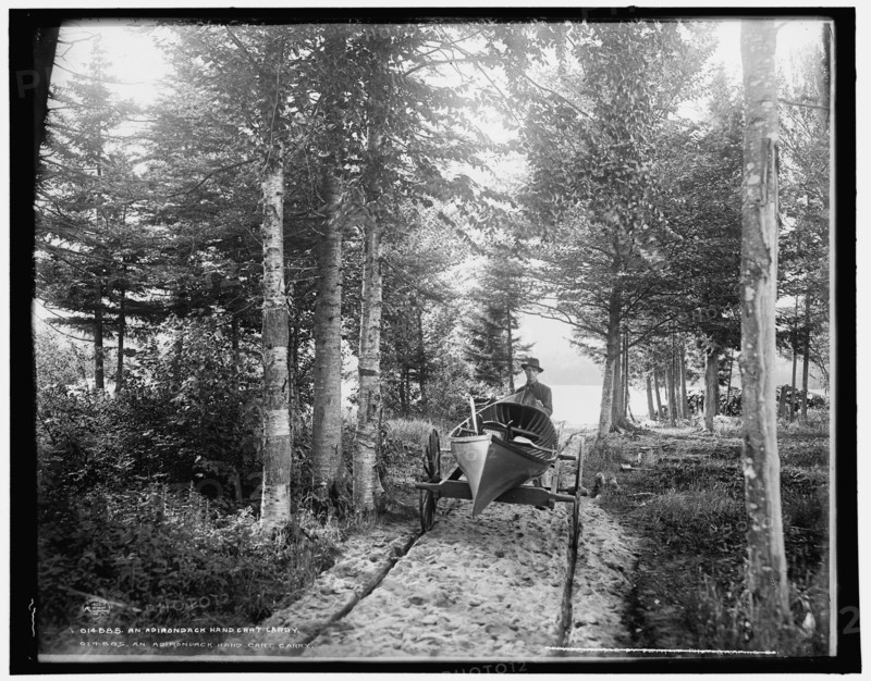 An Adirondack hand cart carry, c1902. Creator: William H. Jackson.