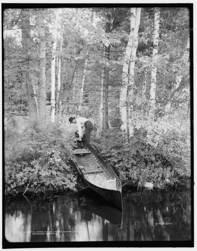 Bartlett's carry, Round Lake, Adirondack Mountains, (1902?). Creator: William H. Jackson.