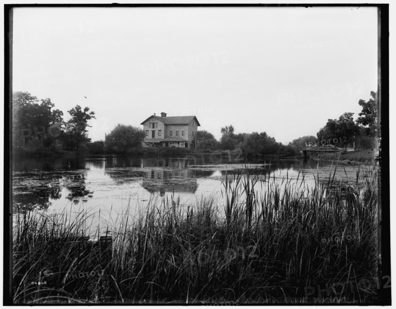 Green Lake, Wis., old mill at railway station, between 1880 and 1899. Creator: Unknown.