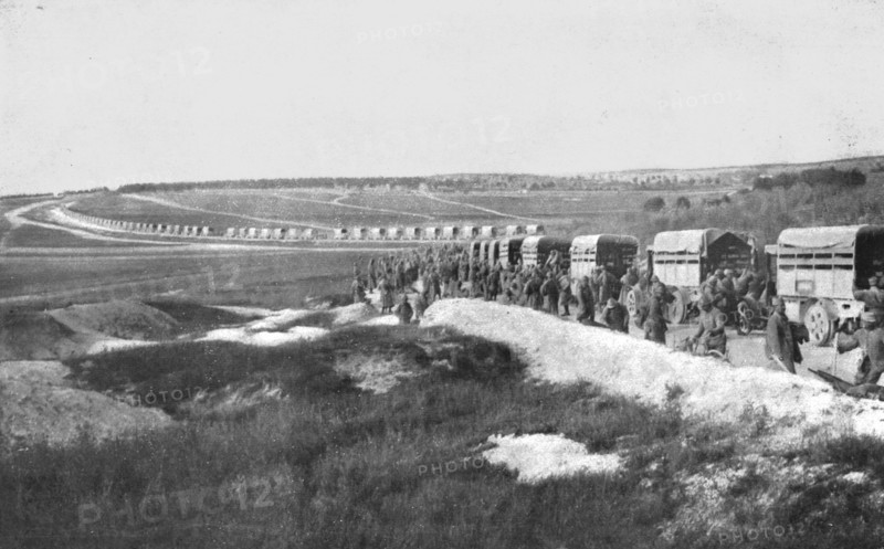 'Au Volant; Sur une route strategique, a proximite de la ligne de feu: releve de troupes par...,1918 Creator: Unknown.