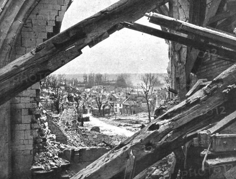 'Dans Montdidier libere; un quartier de Montdidier vu par une breche de l'eglise, apres..., 1918. Creator: Unknown.