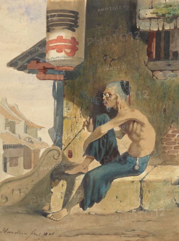 Old, skinny Chinese (opium smoker?) sitting on a sidewalk in Batavia, 1846. Creator: Ernest Alfred Hardouin.