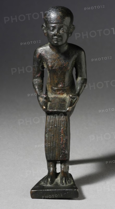 Seated Figure of the God Imhotep Holding a Scroll, 712-332 B.C. or later. Creator: Unknown.