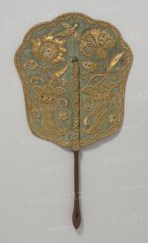 Fixed fan of green silk with straw embroidery and wooden handle, England, c.1740. Creator: Unknown.