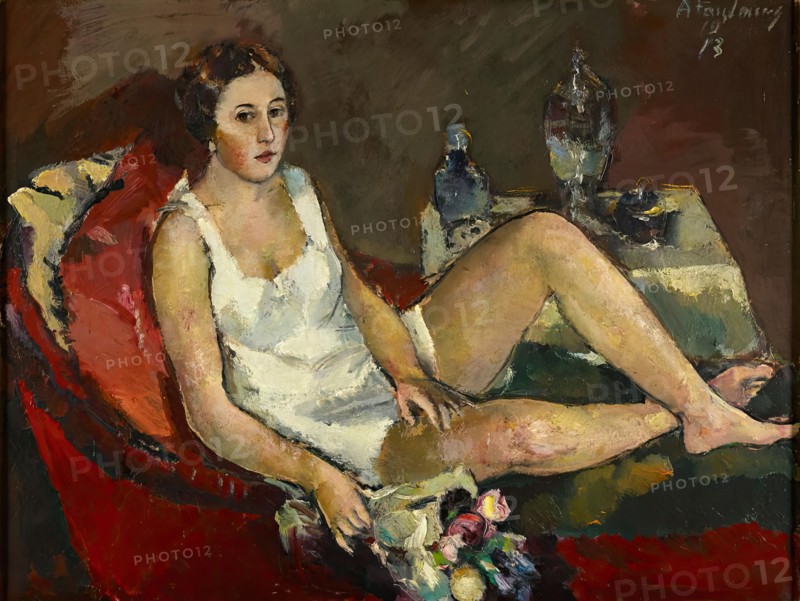 Young woman on red sofa, 1913. Creator: Anton Faistauer.