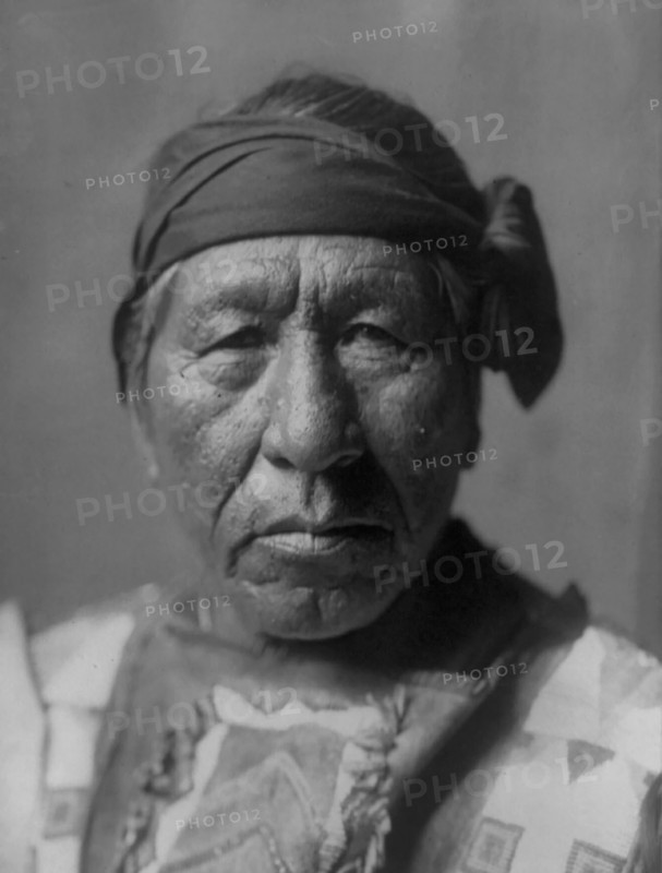 Sitting Owl-Hidatsa, c1908. Creator: Edward Sheriff Curtis.
