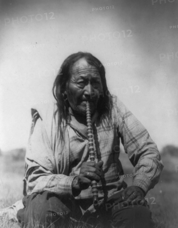 Arapaho Indian smoking pipe, c1910. Creator: Edward Sheriff Curtis.