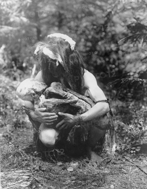 Preparing to eat the mummy, c1911. Creator: Edward Sheriff Curtis.