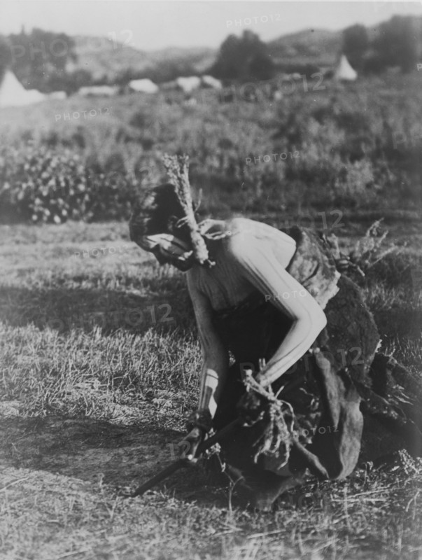 Offering the pipe to the Earth-Cheyenne, c1910. Creator: Edward Sheriff Curtis.