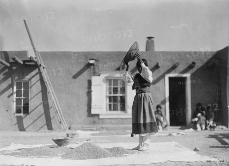 Winnowing wheat, c1905. Creator: Edward Sheriff Curtis.