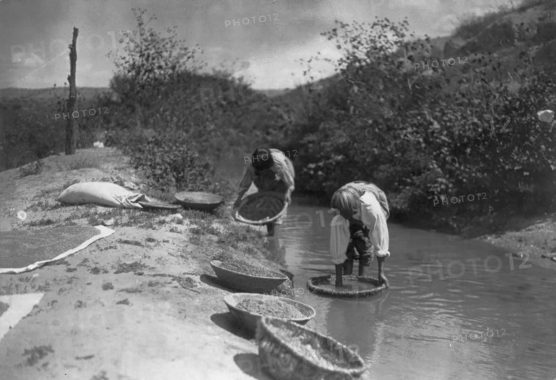 Washing wheat-San Juan, c1905. Creator: Edward Sheriff Curtis.