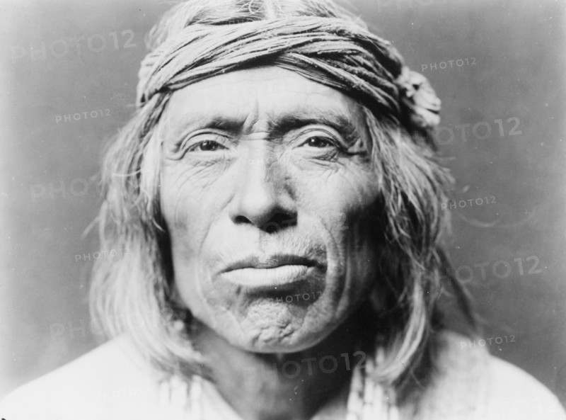 Head-and-shoulders portrait of Shiwawatiwa, a Zuni Indian, facing front, c1903. Creator: Edward Sheriff Curtis.