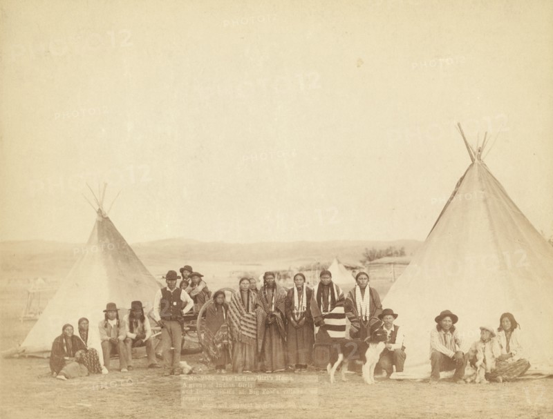 The Indian Girl's Home A group of Indian girls and Indian police at Big Foot's village..., 1890. Creator: John C. H. Grabill.
