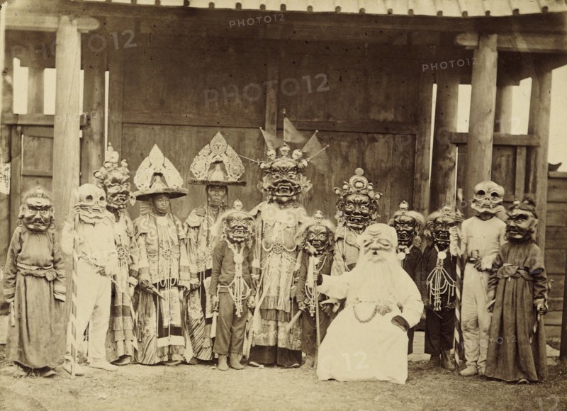 Lamas in masks and costumes participating in a religious dance (tsam)..., 1880-1889. Creator: Peter Adamovich Milevskiy.