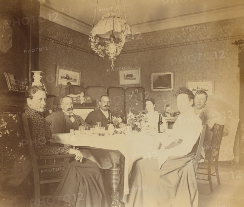 A meal with friends in the drawing room, Dom Smith, Vladivostok, Russia, (1899?). Creator: Frederick S. Pray.