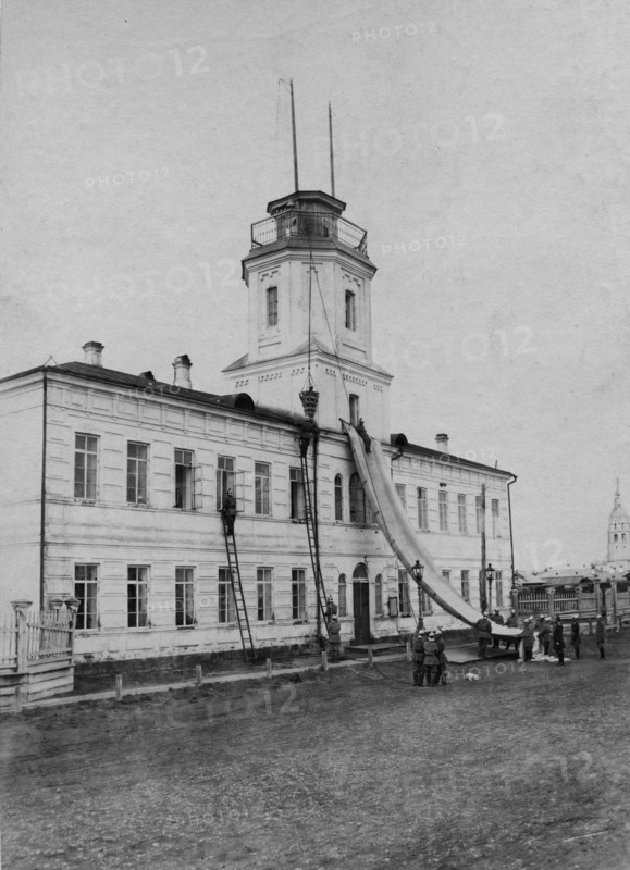 Irkutsk police fire brigade. Exercise with a rescue sheet and a rescue basket, 1894. Creator: R Prorokov.