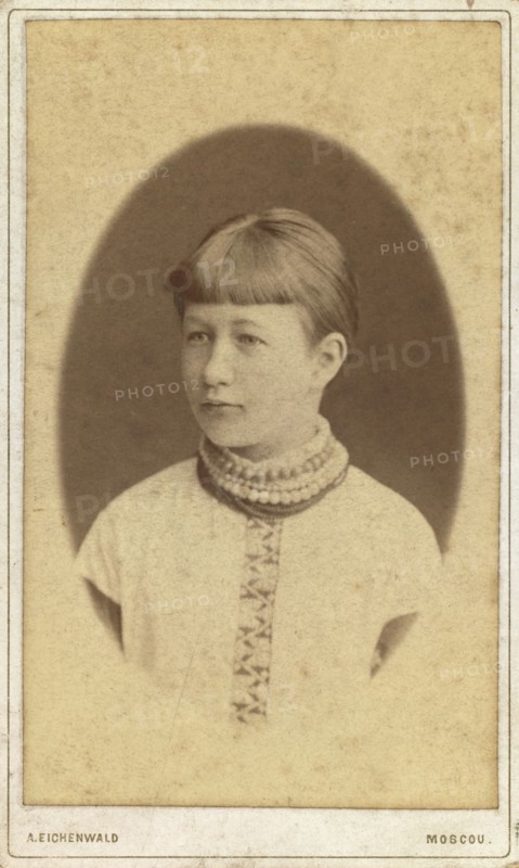 Head-and-shoulders portrait of a young woman, facing left, between 1880 and 1886. Creator: Unknown.