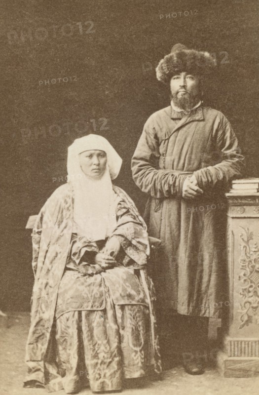 Kazakh man and woman, full-length portrait, between 1870 and 1886. Creator: Unknown.