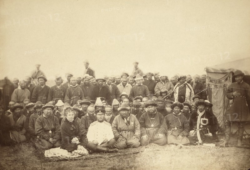 Kirghiz (ie Kazakh) tribesmen with a local Russian Governor and his wife, between 1885 and 1886. Creator: Unknown.
