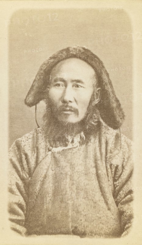 Half-length portrait of man, seated, facing slightly left, between 1870 and 1886. Creator: Unknown.
