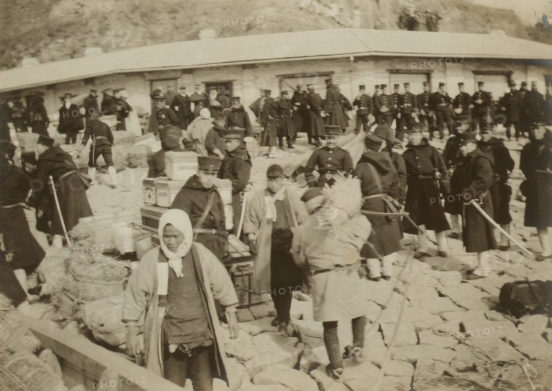 Japanese cavalry troops watching over their supplies on the beach at Chemulpo, 1904. Creator: Robert Lee Dunn.