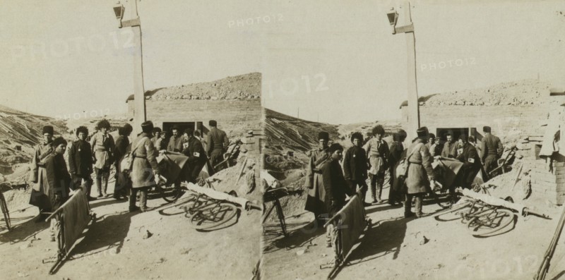 Bicycle stretchers bringing Russian wounded to a surgical station -- siege of Port Arthur, c1905. Creator: Underwood & Underwood.