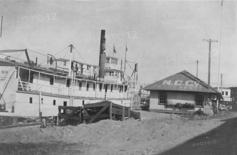 Boat docked at N.C. Co., between c1900 and 1916. Creator: Unknown.