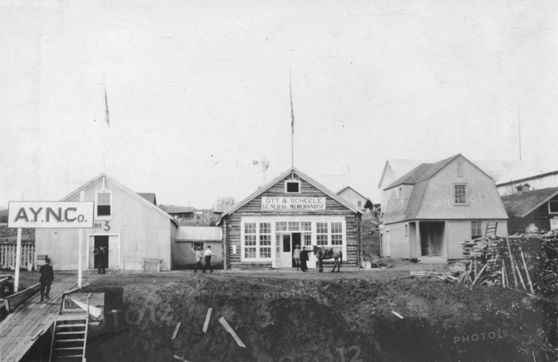 Scene in front of Ott and Scheele's general merchandise store, between c1900 and 1916. Creator: Unknown.