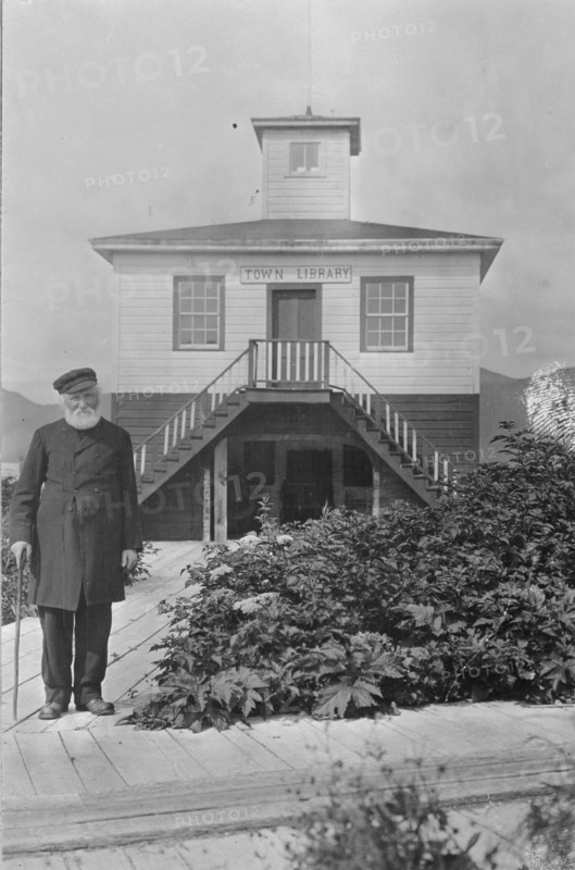 Father William Duncan, a missionary, in front of town library, between c1900 and 1923. Creator: Unknown.