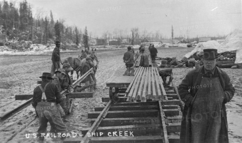 Laying first rails of new U.S. railroad at Ship Creek, between c1900 and c1930. Creator: Unknown.