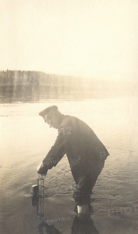 The moment of measuring the water level at the Inorogda hydrometric station, 1909. Creator: Vladimir Ivanovich Fedorov.
