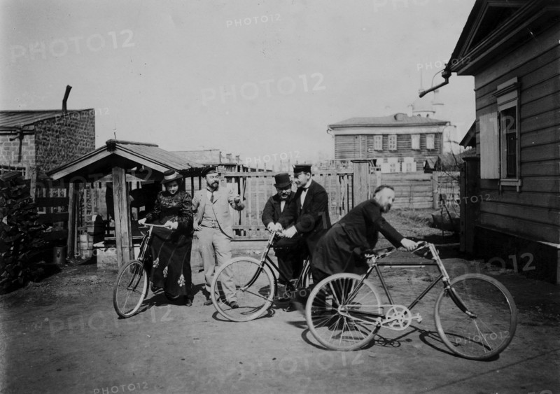 Cyclists in the courtyard of the estate, 1900. Creators: V. I. Podgorbunskii, I. A. Podgorbunskii.