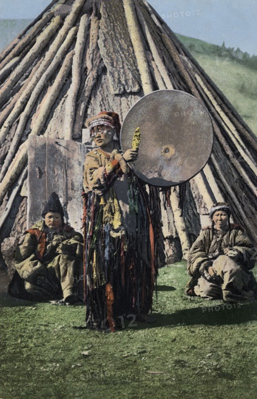 Altai Shaman with Tambourine in Front of a Traditional Dwelling (Chaadyr), 1911-1913. Creator: Sergei Ivanovich Borisov.