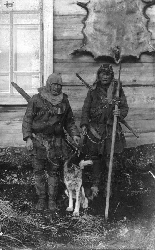Two Chukchi in national clothes, with guns and a spear, 1910-1929. Creator: Ivan Emelianovich Larin.