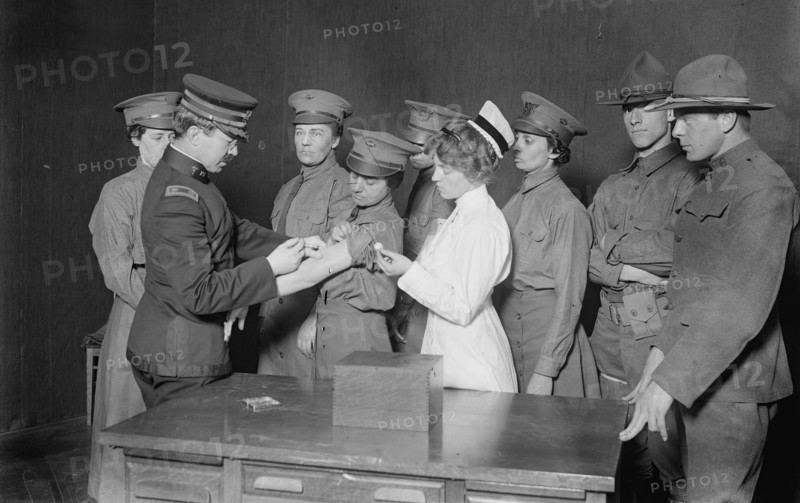 Major Connell inoculating woman motorist, 29 May 1917. Creator: Bain News Service.