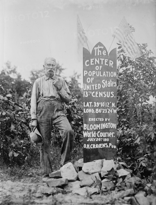 The Center of Population of U.S. [man standing next to memorial stone], between c1910 and c1915. Creator: Bain News Service.