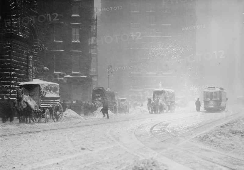 Horse-drawn wagons on snowy street, NY snow storm, 1910. Creator: Bain News Service.