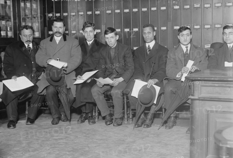 Candidates for naturalization seated with papers, 1910. Creator: Bain News Service.
