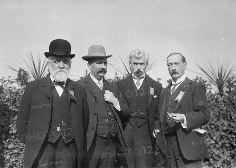 Jos. Ellis, Sir John Randles, G. Muir Ritchie, and Col. Sir Chas. Allen standing together... 1910. Creator: Bain News Service.