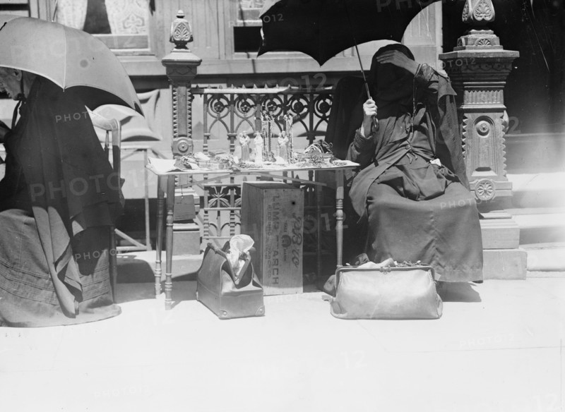 Outside church of St. Jean Baptiste, selling beads, etc., between c1910 and c1915. Creator: Bain News Service.