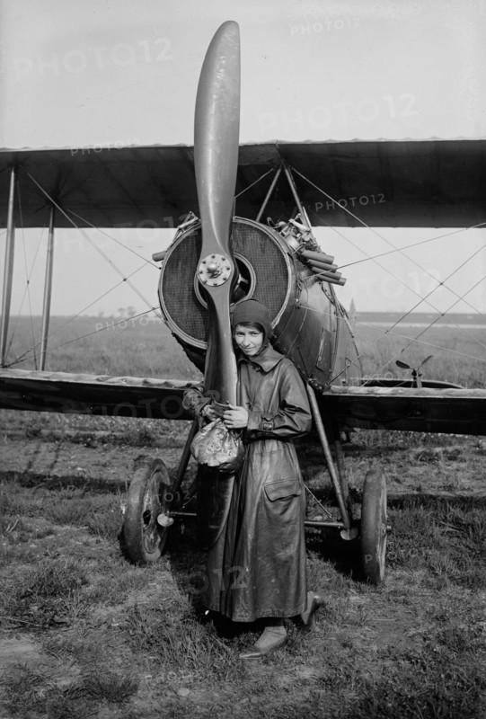 Katherine Stinson with her biplane, 1917 or 1918. Creator: Bain News Service.