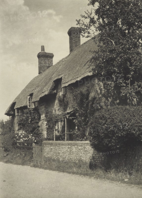 Thatched cottage. From the album: Photograph album - England, 1920s. Creator: Harry Moult.