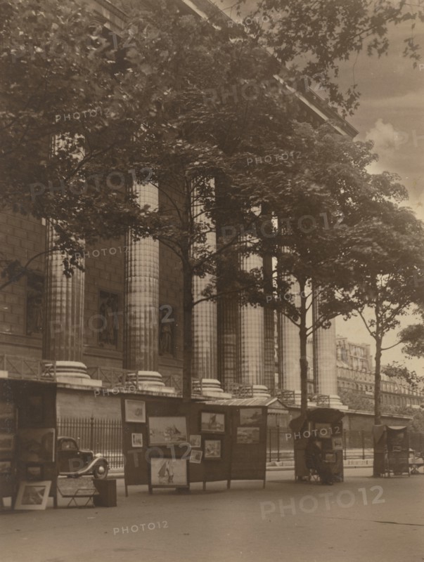 City street with columns of a building and hoardings, 1918-1920s. Creator: Eunice Harriett Garlick.