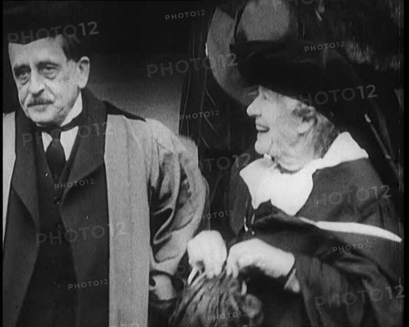 Sir James Barrie and Elen Terry Sitting Together in Academic Dress Outside St Andrew's Uni..., 1922. Creator: British Pathe Ltd.